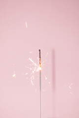 Festive sprinkler on a pinkbackground