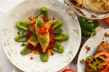 Delicious Fried Fish with Spicy Tomato Sauce and Green Peppers