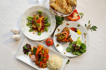 Delicious Indian Food Platter with Naan Bread and Various Dishes