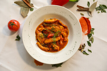 Delicious Chicken Tikka Masala Indian Dish on White Plate