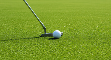 golf putter and ball on green, precision sport equipment emphasized for perfect putt practice. close-up shot highlights details of fresh turf, ideal for athletic branding visuals.