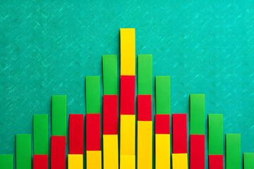 Colorful Bar Graph on Textured Green Background Representing Data Analysis and Statistical Growth with Red, Yellow, and Green Bars for Business and Financial Visualizations