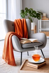 Cozy reading corner with blanket, armchair, and cup of hot tea