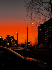 Night city in lanterns against the backdrop of sunset