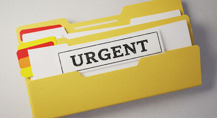 A yellow file folder with documents and an urgent label sticking out on a white background surface
