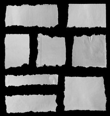 Torn papers on black
