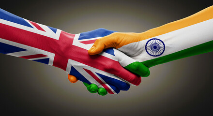 A handshake between hands painted with the flags of the united kingdom and india on a gray background