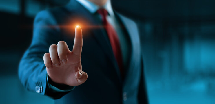 The businessman touch virtual screen. Man presses virtual button. Business Technology Concept