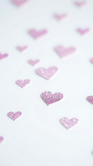 Obraz premium Pastel Glitter Hearts Pattern on White Background vertical