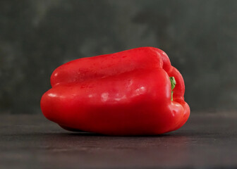 A red pepper sits on a counter