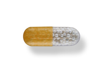 A pill with a yellow and white coating
