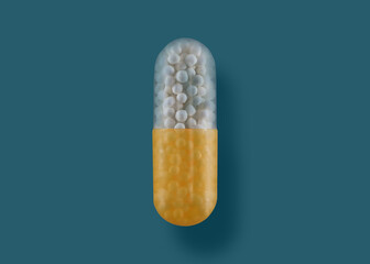 A pill is shown with a blue background