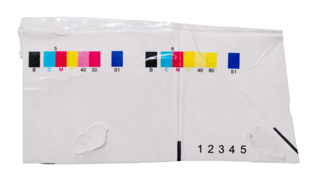 CMYK print test control scales on piece of cardboard from beverage package. Test chart offset