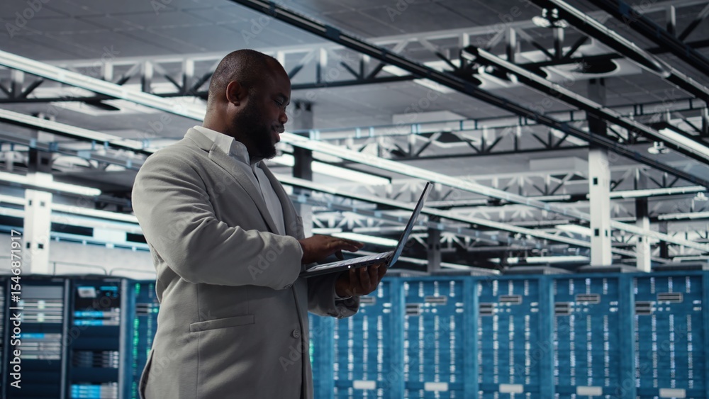 Poster smiling data center technician installing and upgrading hardware components. happy server farm emplo