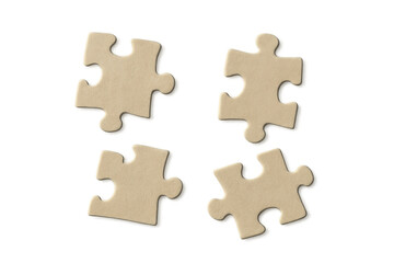 Four separate puzzle pieces lie on a transparent background, symbolizing problem-solving, strategy, and teamwork
