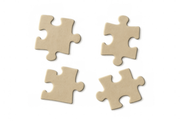 Four separate puzzle pieces lie on a transparent background, symbolizing problem-solving, strategy, and teamwork