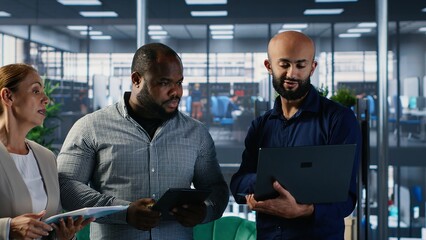 Diverse business CEOs meeting to discuss a new partnership between international firms, analyzing performance metrics and insights before decision making activities. Forecast. Camera B.