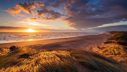golden clouds above quidnet beach at sunrise