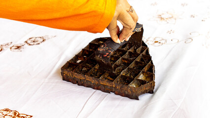 The process of making batik cloth. Batik is a type of cloth whose motifs are made manually, originating from Indonesia.