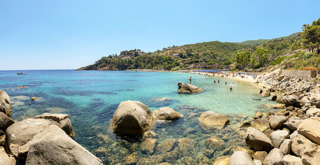 View to Cannelle beach, Spiaggia delle Cannelle, near Giglio Porto with view to mediterranean sea and beautiful blue bay at Isola del Giglio, island of the tuscan archipelago, Grosseto Tuscany Italy