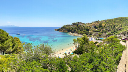 View to Cannelle beach, Spiaggia delle Cannelle, near Giglio Porto with view to mediterranean sea and beautiful blue bay at Isola del Giglio, island of the tuscan archipelago, Grosseto Tuscany Italy