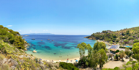 View to Cannelle beach, Spiaggia delle Cannelle, near Giglio Porto with view to mediterranean sea and beautiful blue bay at Isola del Giglio, island of the tuscan archipelago, Grosseto Tuscany Italy