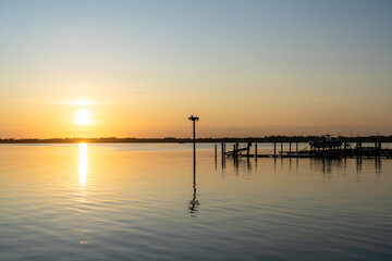 An Osprey Silhouette on a Stand as the Sun Sets on the Albemarle Sound in Kill Devil Hills North...