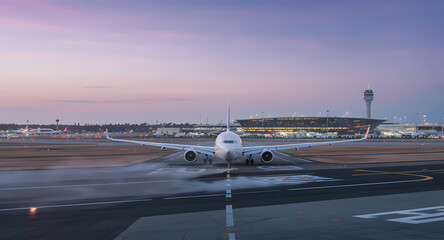 Airplane Taxiing on Runway at Dawn Breathtaking Airport Scene
