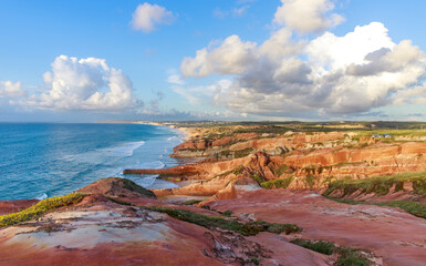 Obraz premium Spectacular Pacific coastline landscape at sunset, colorful beach with cliffs from aerial view , Peniche, Portugal