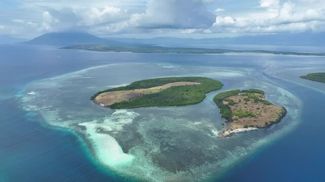 Reefs surround scenic islands off the coast of Adonara in the Lesser Sunda Islands of Indonesia. This tropical region supports some of the world's greatest marine biodiversity.