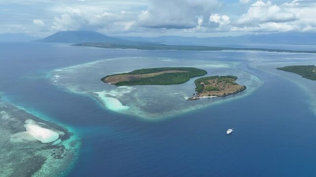 Reefs surround scenic islands off the coast of Adonara in the Lesser Sunda Islands of Indonesia. This tropical region supports some of the world's greatest marine biodiversity.