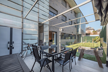Outdoor Dining Table: Made of durable materials such as aluminum