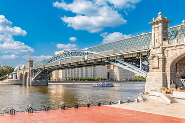View of the Moscow river embankment, Pushkinsky bridge and cruise ships at sunset.