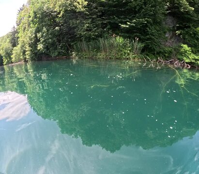 Lake of Levico in Trentino, northern Italy, seen during a hike on a stand up paddle board on a beautiful day in June