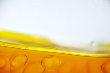 Macro texture of melted fish oil capsule in hot container