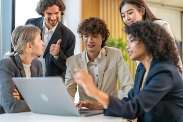 Diverse team brainstorming business meeting, professional presentation with data charts, team collaboration for project planning, modern corporate office teamwork, group discussing business strategies