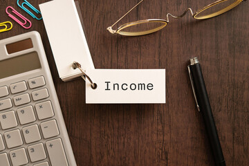 There is word card with the word Income. It is as an eye-catching image.