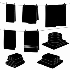 Towels on clothesline and folded stacks monochrome