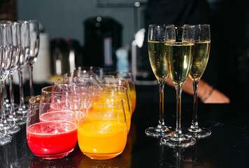 Assorted drinks on bar counter for event.