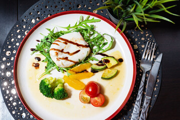 Gourmet burrata salad with vegetables and balsamic.