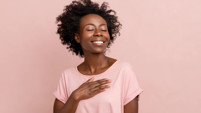 person showing supportive gesture with warm smile standing confidently against clean background