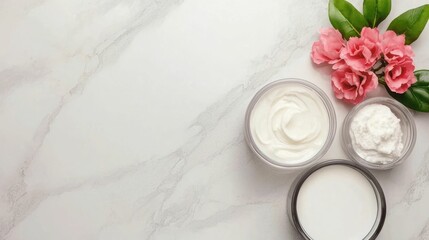 Flat lay arrangement of various ingredients and products for homemade or DIY moisturizer on a neutral marble or stone countertop background  Natural organic skincare concept with botanical elements