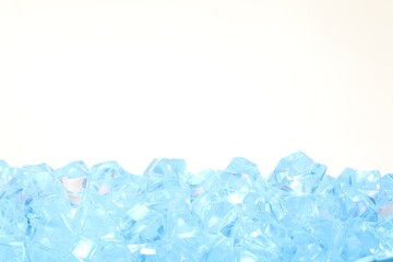 Cubes of clear ice on white background