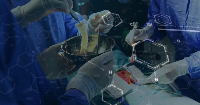 Manipulating tissue graft in bowl using forceps and scalpel in OR with scrubs and chemical overlays