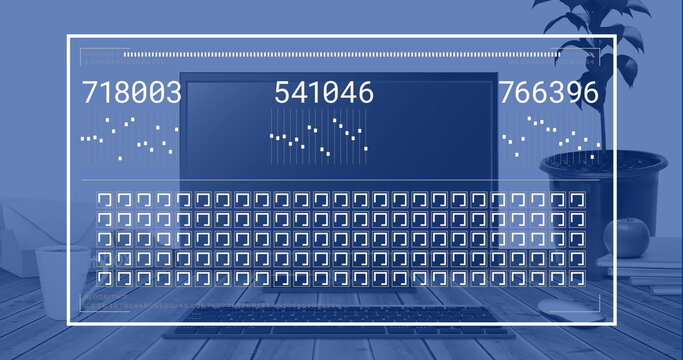Displaying laptop showing numeric codes and grid on dark screen at home office, with plant, books