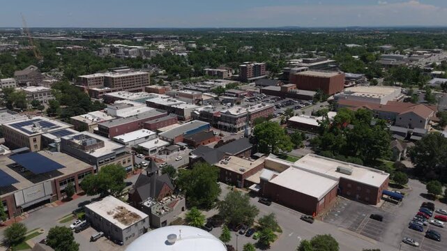 view of downtown Bentonville Arkansas descending revealing iconic water tank