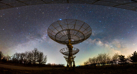 radio telescope on the background of stellar tracks, The observatory's radio telescope