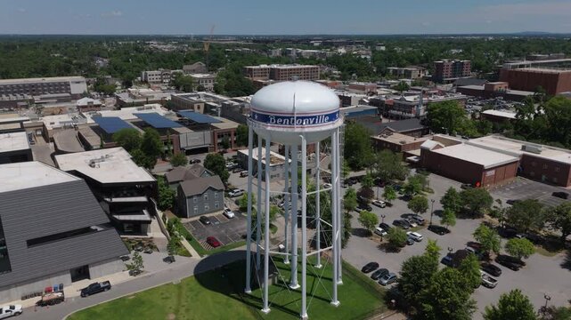flying over iconic water tank towards downtown Bentonville Arkansas