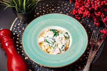 Creamy Chicken Pasta with Spinach in Bowl.