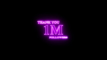 Illuminated neon sign celebrating one million followers on a black background expressing gratitude to social media audience